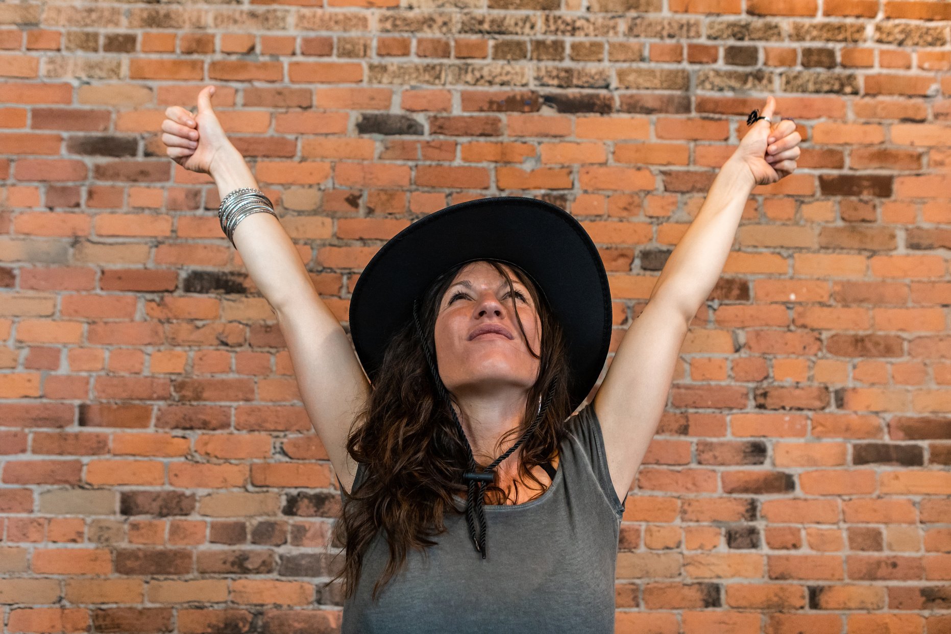 Empowered woman with arms in air